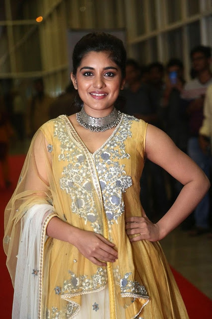 Telugu Girl Niveda Thomas Long Hair In Yellow Dress 19